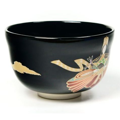 Side angle of black matcha bowl, showing glaze and Ningyo design