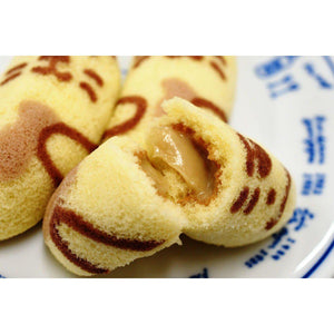 Close-up of Tokyo Banana Cake Racco Coffee Milk Flavor 8 Pieces, showing soft texture and creamy filling