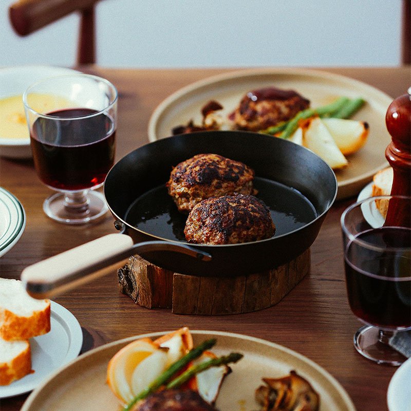 Side profile of Enzo iron frying pan with wood handle