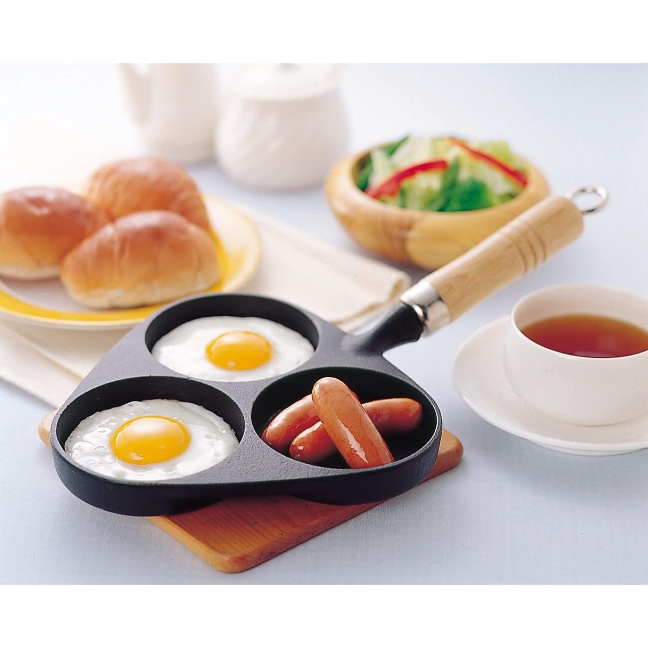 3-Egg Pan by Iwachu, cast iron with wooden handle, designed for induction and gas stovetops