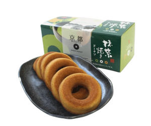 Single Naniwaya Kyoto Matcha Baked Donut on plate with a cup of green tea