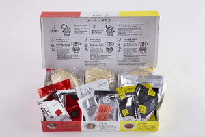 Close-up of Ippudo Souvenir Ramen 3 Types Set (White x 1 Red x 1 Karaka x 1), featuring tonkotsu broth packets for umami depth