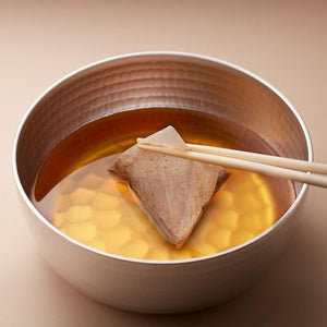 Close-up of Kyuemon Awase Dashi Premium Natural Dashi Stock Powder 15 Packets, featuring bonito flakes for umami enhancement