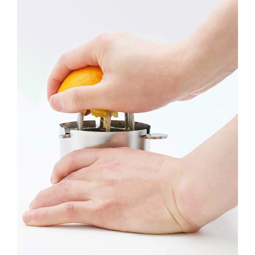Compact Wadasuke Manual Citrus Juicer with stainless steel strainer, designed for easy home use