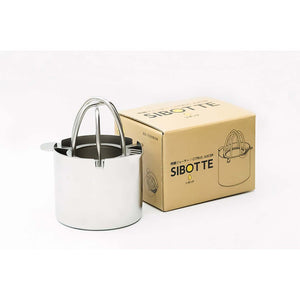 Wadasuke Manual Citrus Juicer with cup and strainer, perfect for simple citrus juicing at home