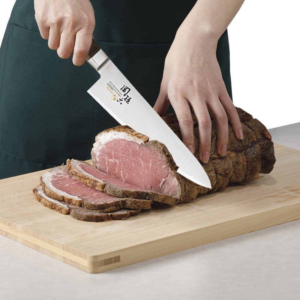 180mm KAI Seki Magoroku knife with wooden handle, designed for everyday kitchen use