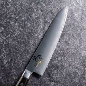 KAI Seki Magoroku Mokuren Gyuto Knife in 180mm, lightweight and balanced, perfect for chefs
