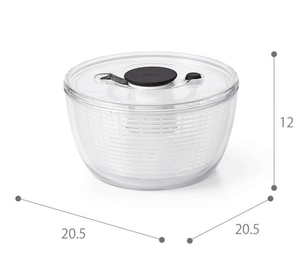 Close-up of OXO Salad Spinner And Peeler Set, featuring smooth spin technology for crisp greens