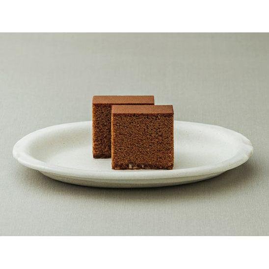 Single piece Shooken Chocolate Castella Cake, soft and fluffy, designed for dessert lovers