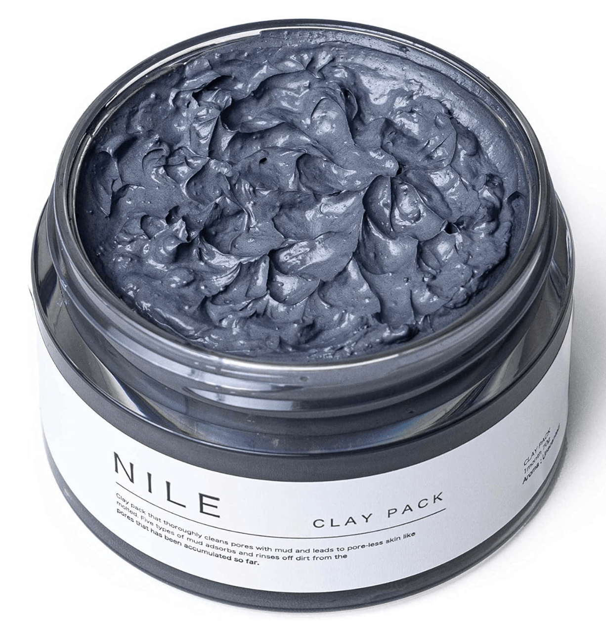 “Close-up texture of NILE Mud Pack showing creamy mud with mineral clay particles”