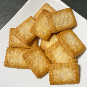 90g Nissin Coconut Sable Mini Cookies with coconut flavor, offering sweet crunchy bites for all ages.