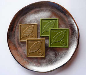 Close‑up of Kiyoizumi matcha and hojicha flavored chocolates, showing two flavors