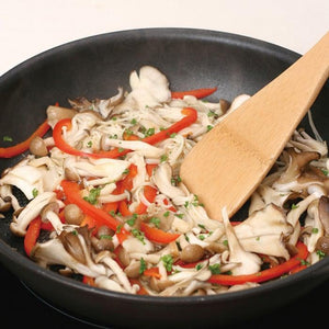 Close-up of Natural Bamboo Kitchen Turner 300mm, featuring polished bamboo for easy flipping and stirring