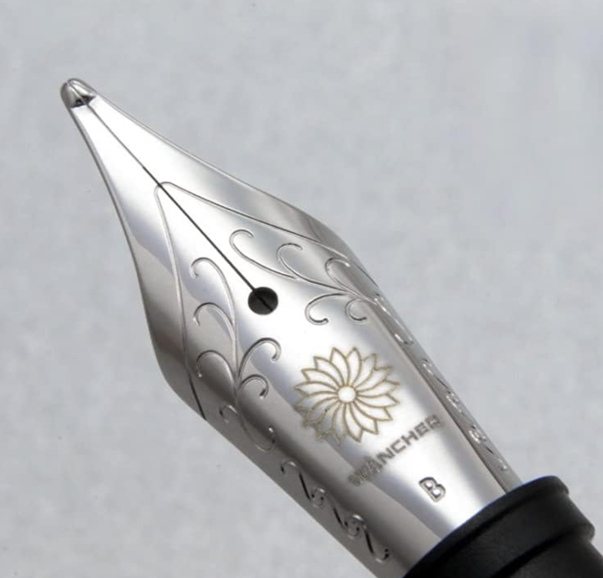 Ebony barrel and cap of the Wancher World Tree Fountain Pen, bold nib, handcrafted natural wood texture