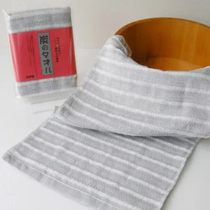 Close-up of Orim Binchotan Charcoal Body Scrub Towel texture, designed for daily skin care