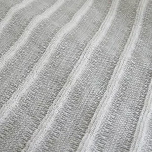 Orim Binchotan Charcoal Body Scrub Towel in use, showcasing gentle exfoliating fibers for smooth skin