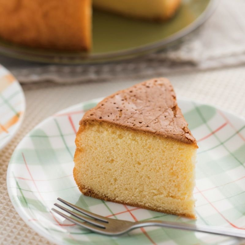 Single piece of Ginnomori Maman Castella Cake on white plate, handmade with premium honey