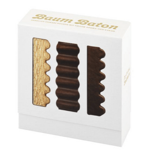 Three Baum Baton 09 sticks displayed side by side, rich milk chocolate coating visibl