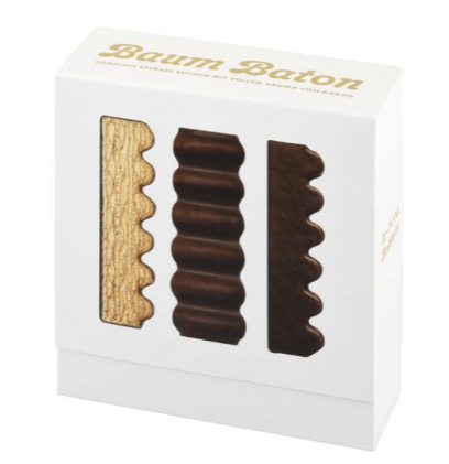 Three Baum Baton 09 sticks displayed side by side, rich milk chocolate coating visibl