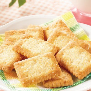 Close-up of Nissin Coconut Sable Mini Family Pack Japanese Coconut Cookies 90g featuring crispy texture for tea time enjoyment