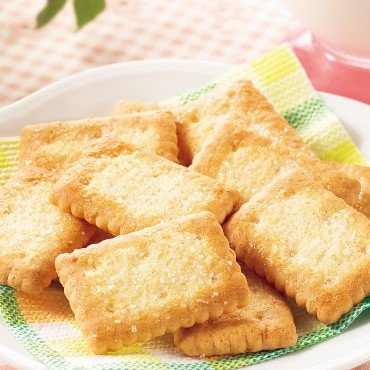 Close-up of Nissin Coconut Sable Mini Family Pack Japanese Coconut Cookies 90g featuring crispy texture for tea time enjoyment