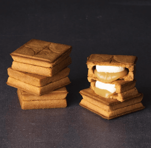Close-up of Press Butter Sand Plain Butter Sandwich Cookie, showing crisp shell and creamy caramel filling