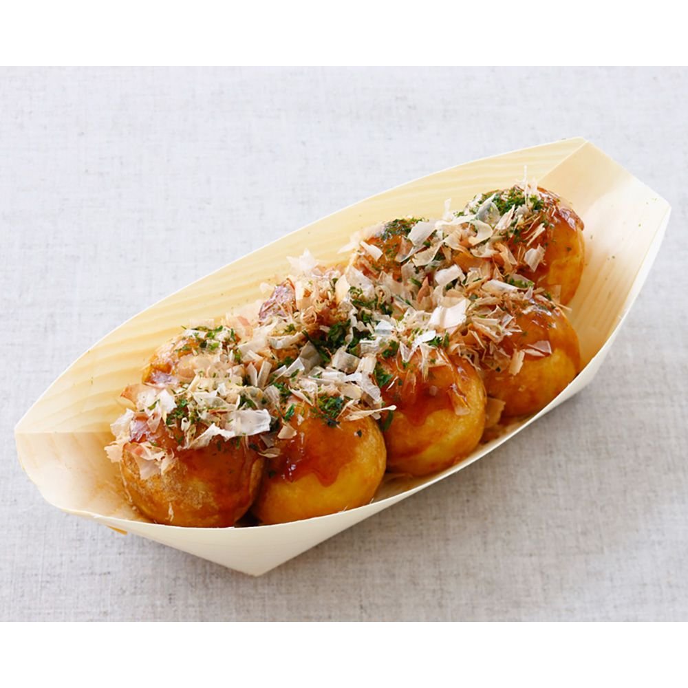 Close-up of Iwachu Cast Iron Takoyaki Frying Pan 14-Ball Capacity showcasing deep round molds for even cooking.