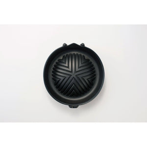 Close-up of Iwachu Cast Iron Jingisukan Grill Pot 23006 showing dome shape for even heat and fat drainage