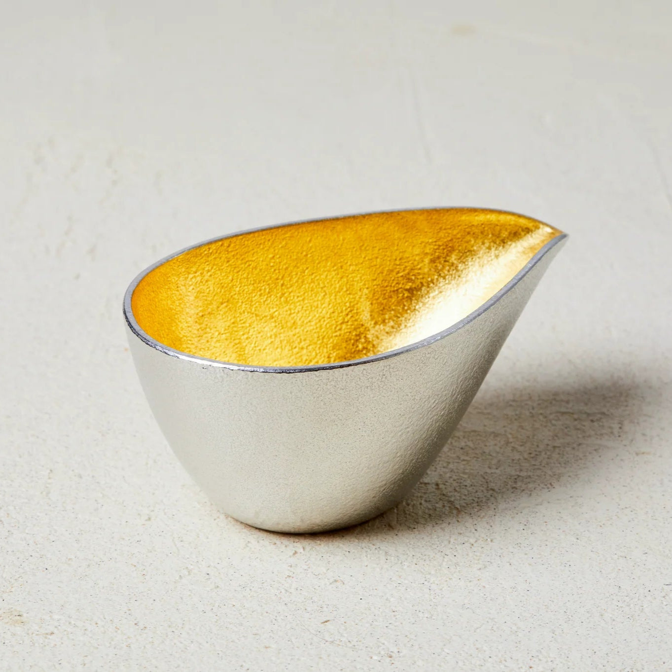 Close-up of Nousaku Tinware Katakuchi Lipped Sake Server, 150ml, featuring kinpaku gold for elegance