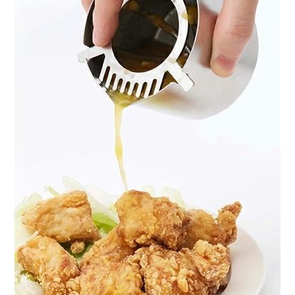 Close-up of Stylish Manual Citrus Juicer showing stainless steel strainer for smooth juice filtering