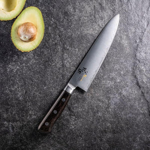 Close-up of KAI Gyuto Knife 180mm, stainless steel blade featuring clean edge for sharp cuts