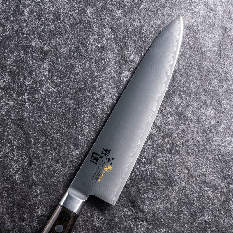 KAI Seki Magoroku Mokuren Gyuto Knife in 180mm, lightweight and balanced, perfect for chefs
