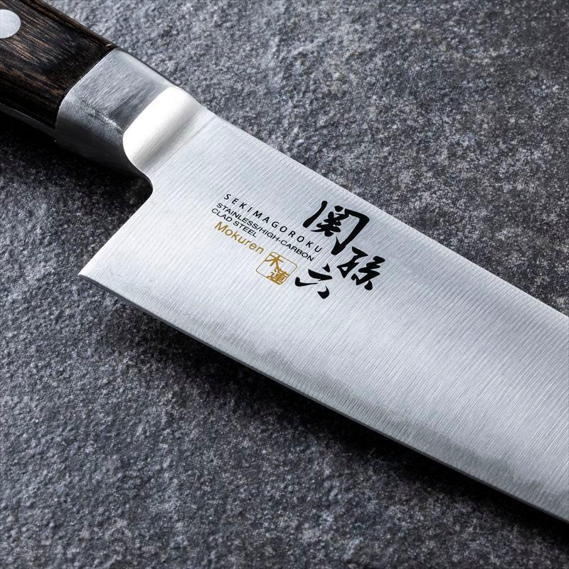 180mm KAI Mokuren knife with ergonomic handle, offering control and comfort for home cooks