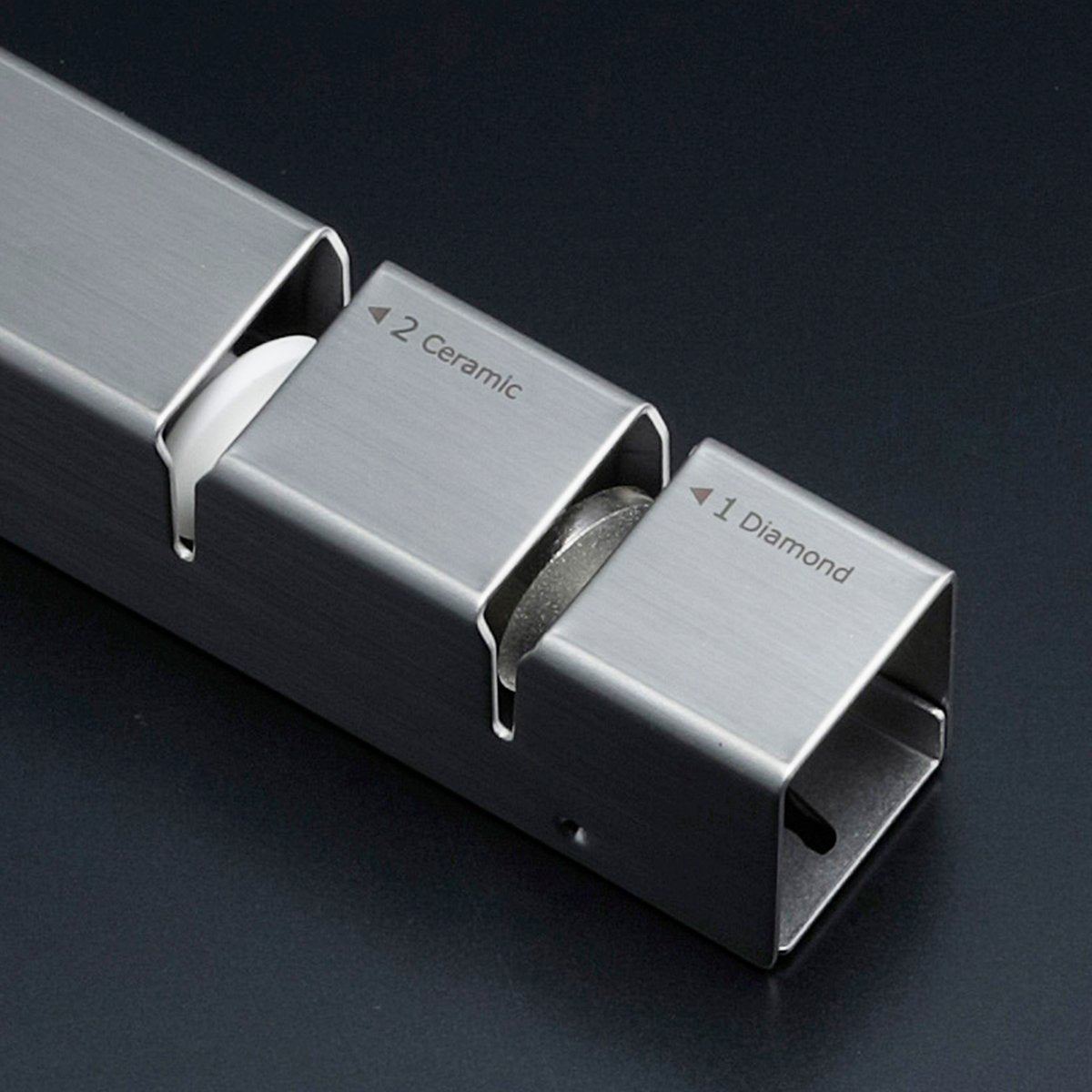 Close-up of Shimomura diamond and ceramic knife sharpener, showing dual sharpening stages