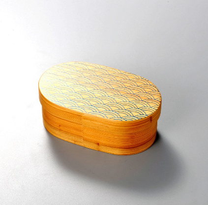 Close-up of Isuke Wood Bento Box, fine lacquer finish and Seigaiha wave design for a refined Japanese touch.
