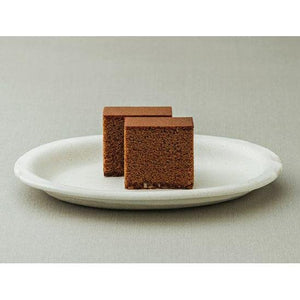 Single piece Shooken Chocolate Castella Cake, soft and fluffy, designed for dessert lovers