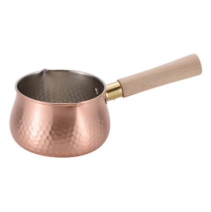 Close-up of Chitose copper milk pan 12cm featuring hammered texture and smooth pouring lip