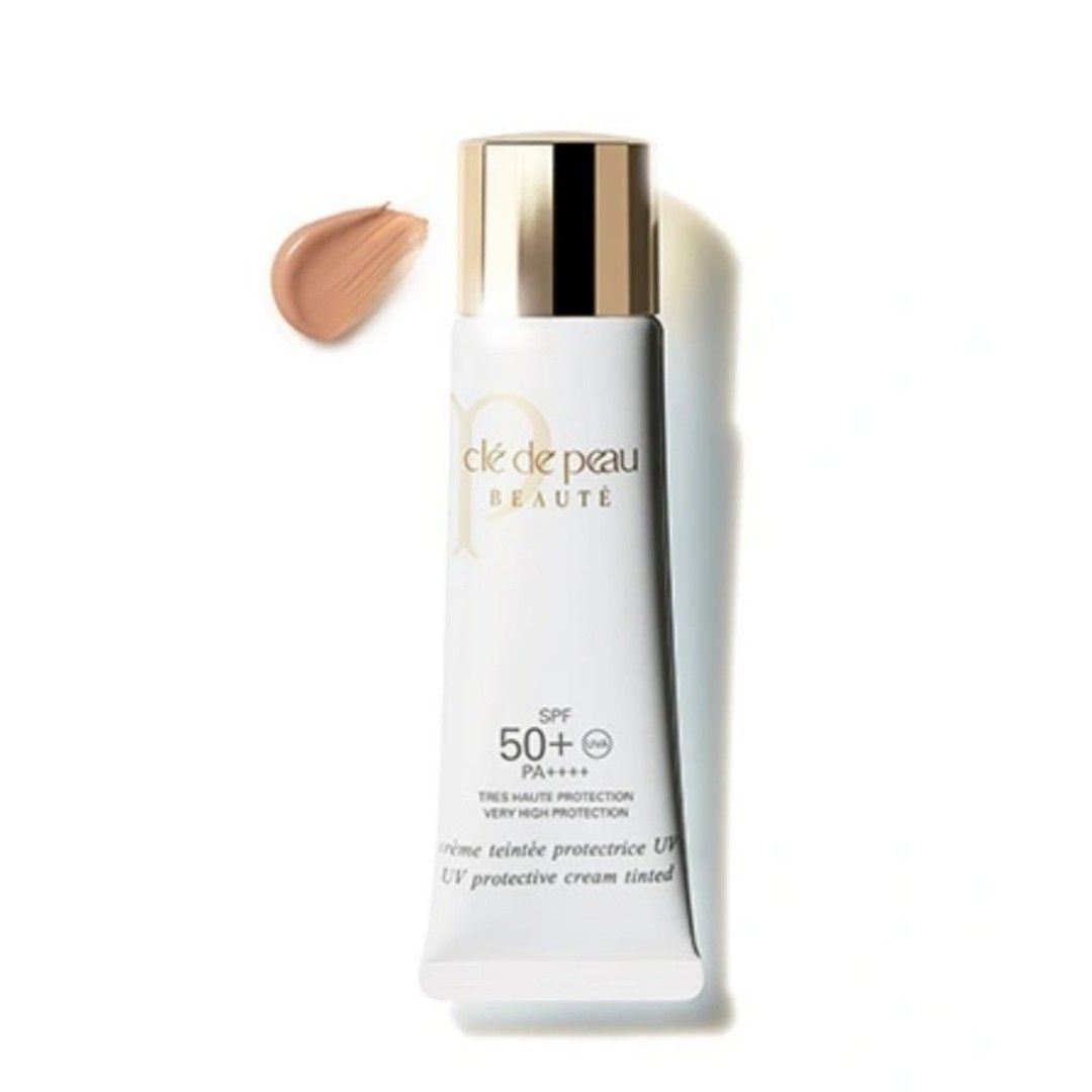 Close-up of Clé de Peau Beauté UV Protective Cream Tinted SPF50+ PA++++ 30ml Ivory, featuring quick-absorbing texture for even tone