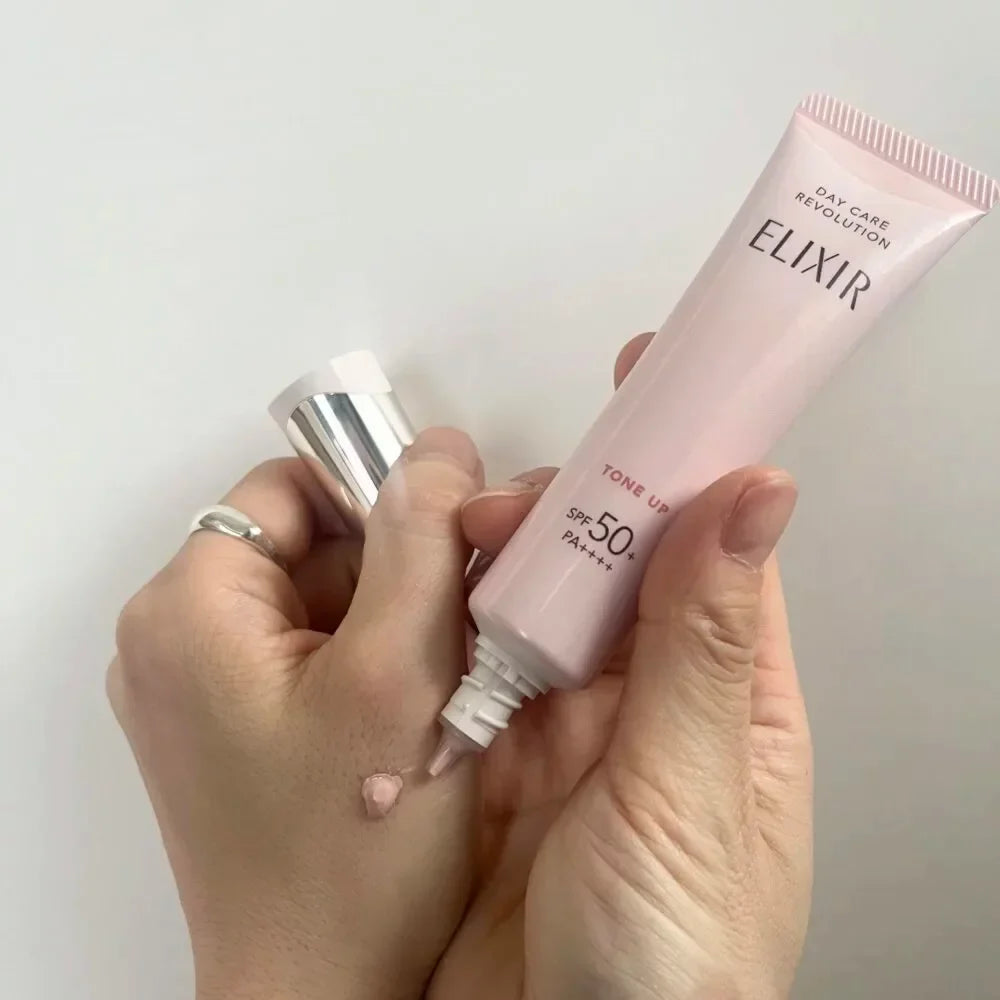 35g Shiseido Elixir Day Care Multifunctional Tone Up Emulsion Baby Pink SPF 50+ with quick-absorbing texture, offering firmness for sensitive skin