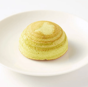 Close-up of Muji Dome Baumkuchen With Soybean Paste, featuring soft layers for a gentle snack moment