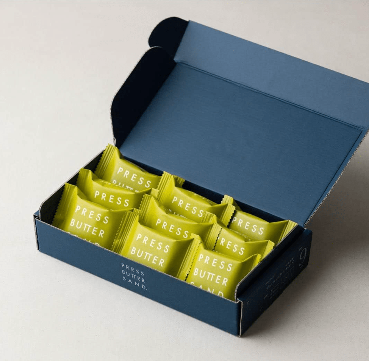 9-piece PRESS BUTTER SAND Uji Matcha, elegant packaging with matcha cream filling, crafted for sharing.