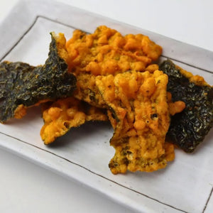 70g Daiko Noriten Biriri Kun Extra Spicy Togarashi Tempura Seaweed Chips (Pack of 12) with tempura nori, offering crunchy texture for gatherings