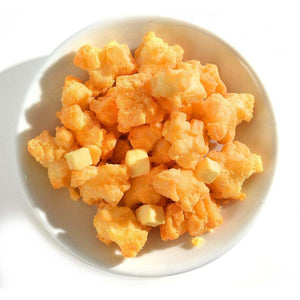 Close-up of Yoshimi Hokkaido Cheese Okaki Cheesy Rice Crackers 102g, featuring Gouda and Cheddar powder for enhanced savoriness