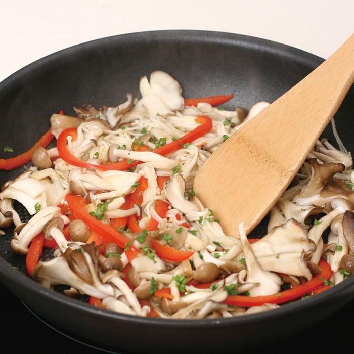 Close-up of Natural Bamboo Kitchen Turner 300mm, featuring polished bamboo for easy flipping and stirring