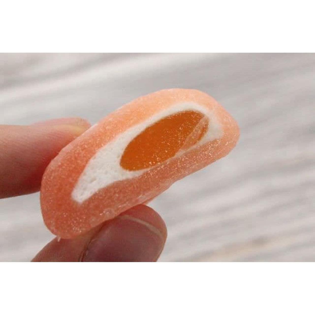Close-up of Nihonbashi Fujiya Peach Nectar Filled Mochi showing soft texture and juicy peach nectar filling for a refreshing treat