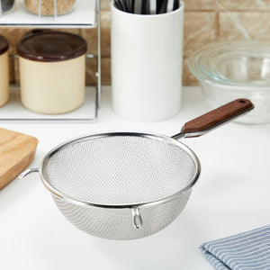 Side view of double mesh fine strainer with wooden handle