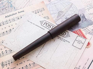 Close-up of Wancher World Tree Fountain Pen showing bold nib and natural ebony grain in elegant finish