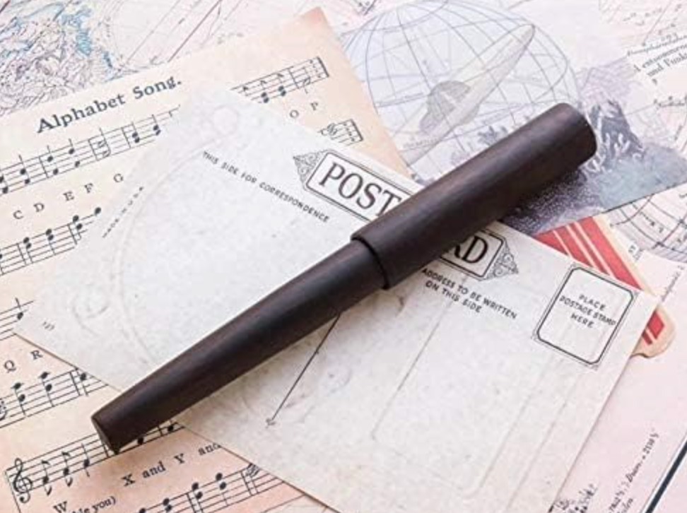 Close-up of Wancher World Tree Fountain Pen showing bold nib and natural ebony grain in elegant finish