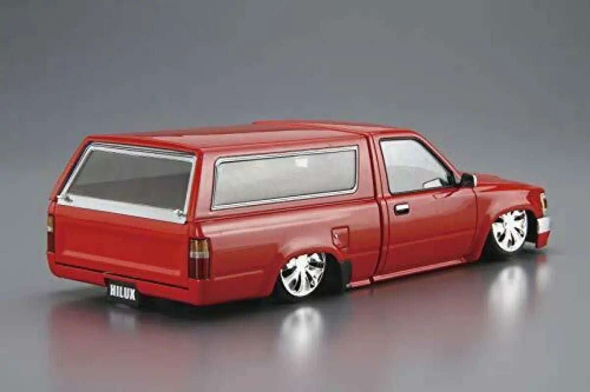 Close-up of Aoshima 1/24 Yn86 Hilux Old School '95 Toyota, featuring realistic suspension for authentic assembly